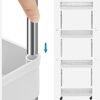 Justering af opbevaringsvogns hylde med finger.