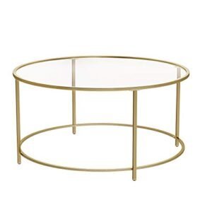 Elegant rundt sofabord med glas og stålramme i guldfinish.