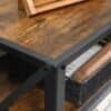Stilfuldt TV-stativ til op til 60 tommer med rustik brun og sort finish.