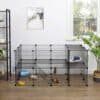 Sort metal pet playpen med 2 etager og adgangsportal.