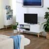 Hvidt skandinavisk TV-stativ med underholdningscenter og planter.