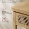 Konsolbord i eg beige med rattan front og afrundede hjørner.